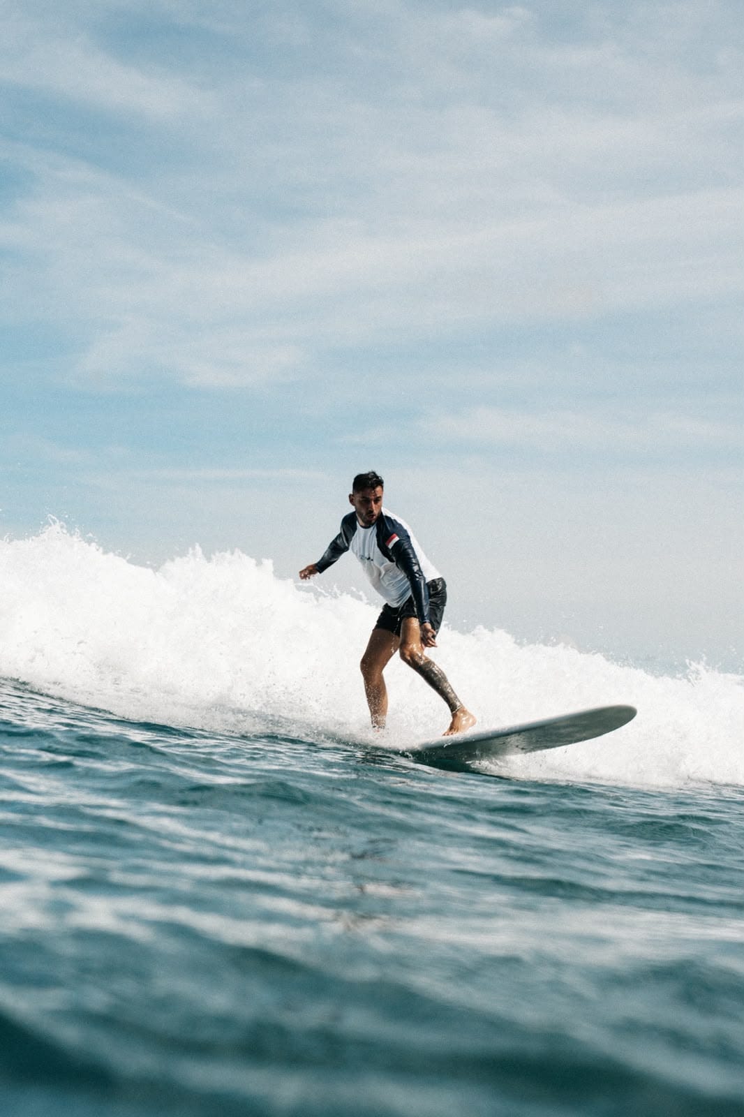 A guest surfing a wave